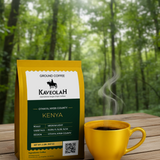 Kaveolah Kenya coffee package with a yellow mug of coffee on a wooden surface with a forest background